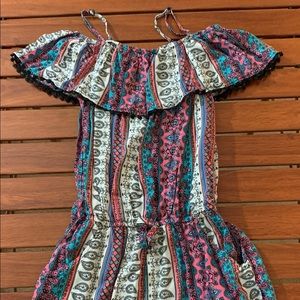 Romper shorts with off the shoulder top.